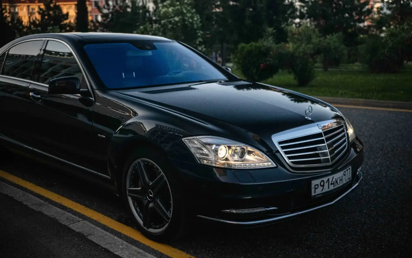Black luxury sedan ready for peak and holiday airport transfers