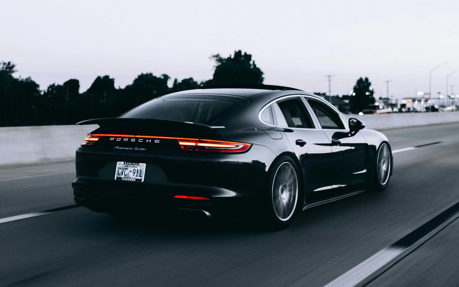 Luxury sedan on the road for hourly as-directed chauffeur service