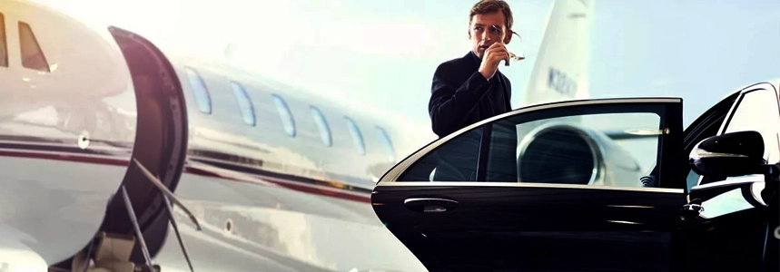 Luxury SUV parked at airport terminal for premium transfer